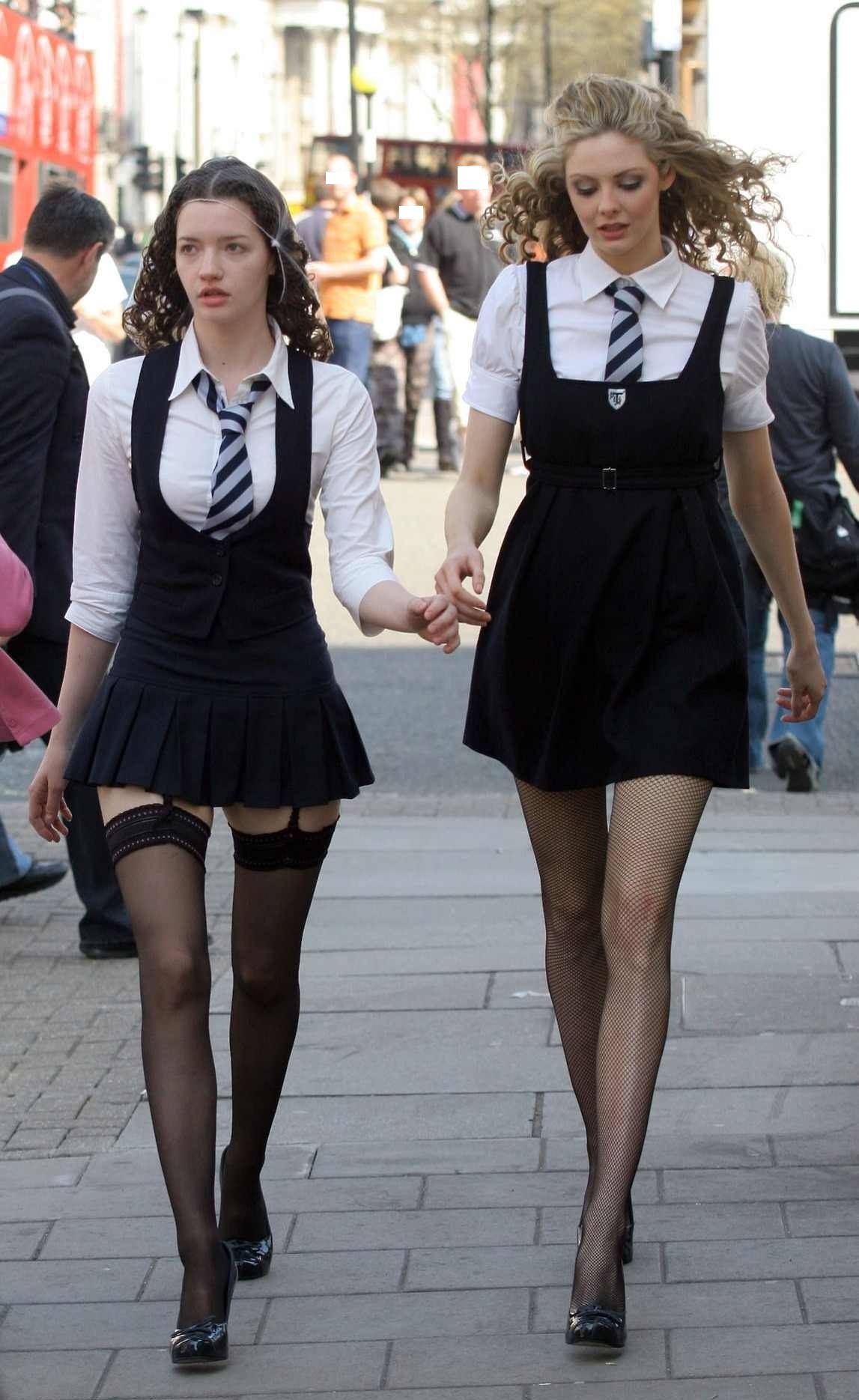 Two Schoolgirls wearing Black Sheer and Fishnet Stockings and Black High Heels